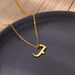 Gold Arabic Initial Necklace featuring a minimalist Arabic letter pendant on a delicate chain.