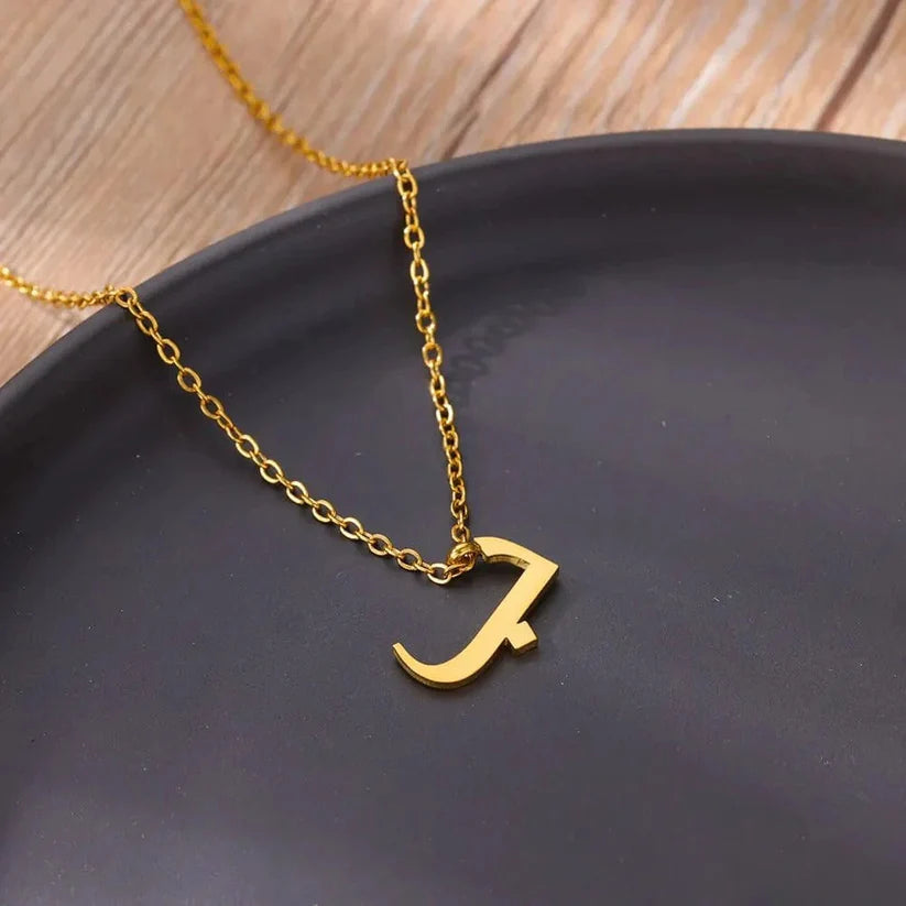 Gold Arabic Initial Necklace featuring a minimalist Arabic letter pendant on a delicate chain.