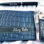 Personalized blue leather wallet with matching pen and keychain gift set featuring custom name detailing