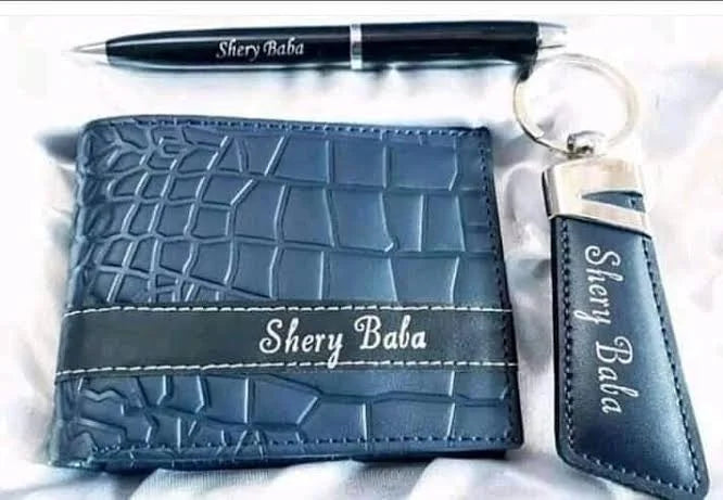 Personalized blue leather wallet with matching pen and keychain gift set featuring custom name detailing