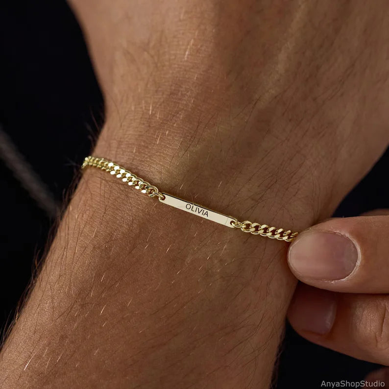 Custom name bar bracelet for men featuring an engraved rectangular name plate with a classic chain design in a golden finish.