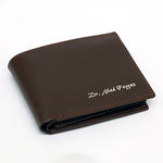 Custom name brown leather bifold wallet with contrast stitching and personalised name detail on the front.