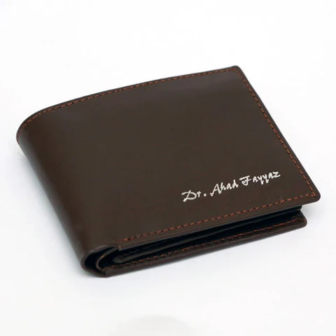 Custom name brown leather bifold wallet with contrast stitching and personalised name detail on the front.