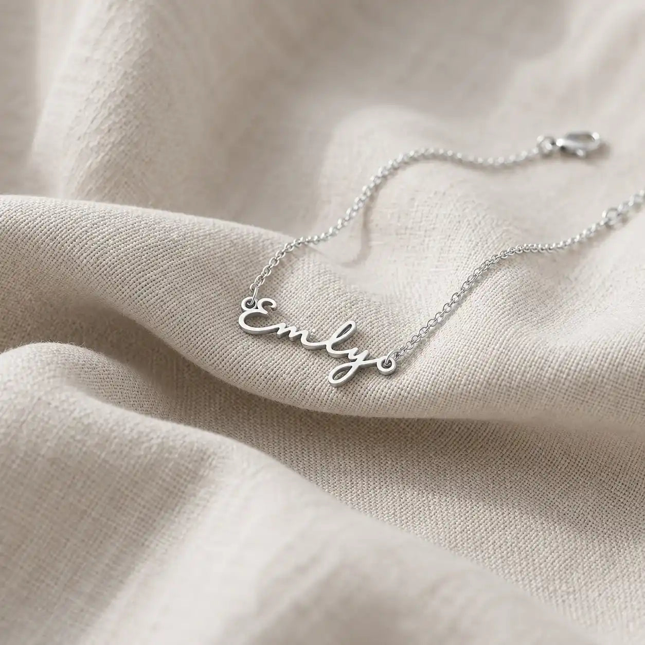 Personalized silver name necklace with a custom script pendant on a delicate chain.