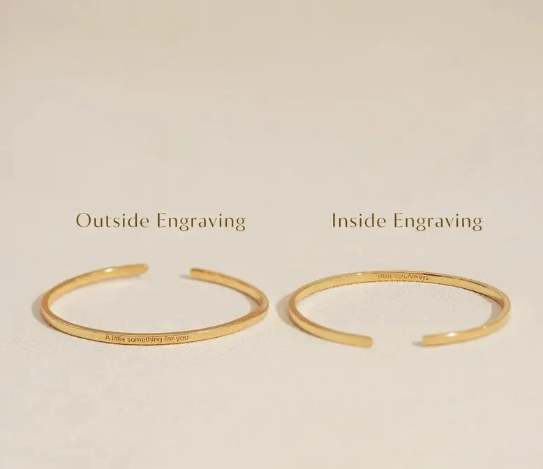 Gold cuff bracelet showing outside and inside engraving options for personalized custom engraving.
