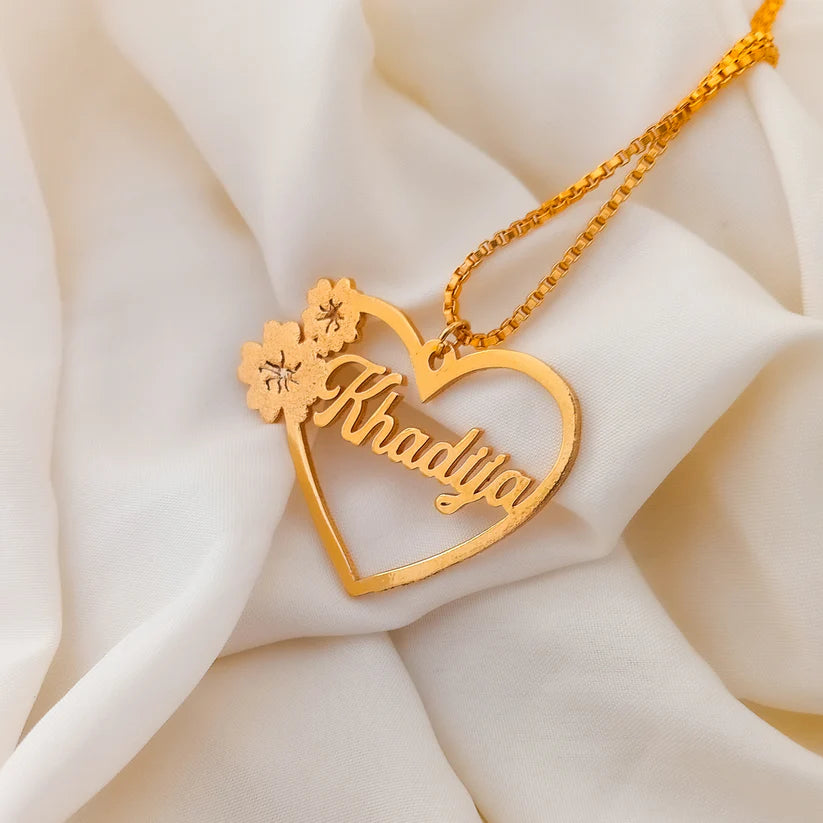 Floral Heart Personalized Name Necklace in gold featuring a custom name inside a heart-shaped pendant with delicate floral detailing.