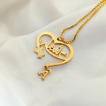 Heart Arabic Dangle Initial Personalized Name Necklace in gold featuring a custom Arabic name inside a heart pendant with a dangling initial charm.