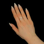 Silver adjustable initial ring with paved M and A letters on hand