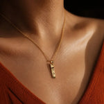 Personalized Eye Pendant featuring a custom engraved eye design on a slim vertical necklace.