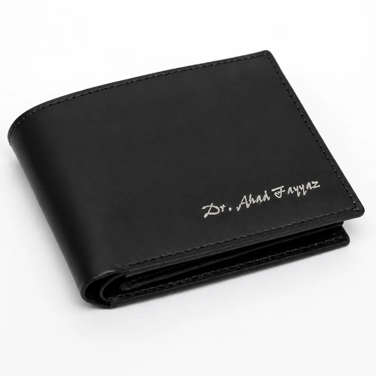 Custom name engraved black leather bifold wallet for men with minimalist stitching and sleek everyday design