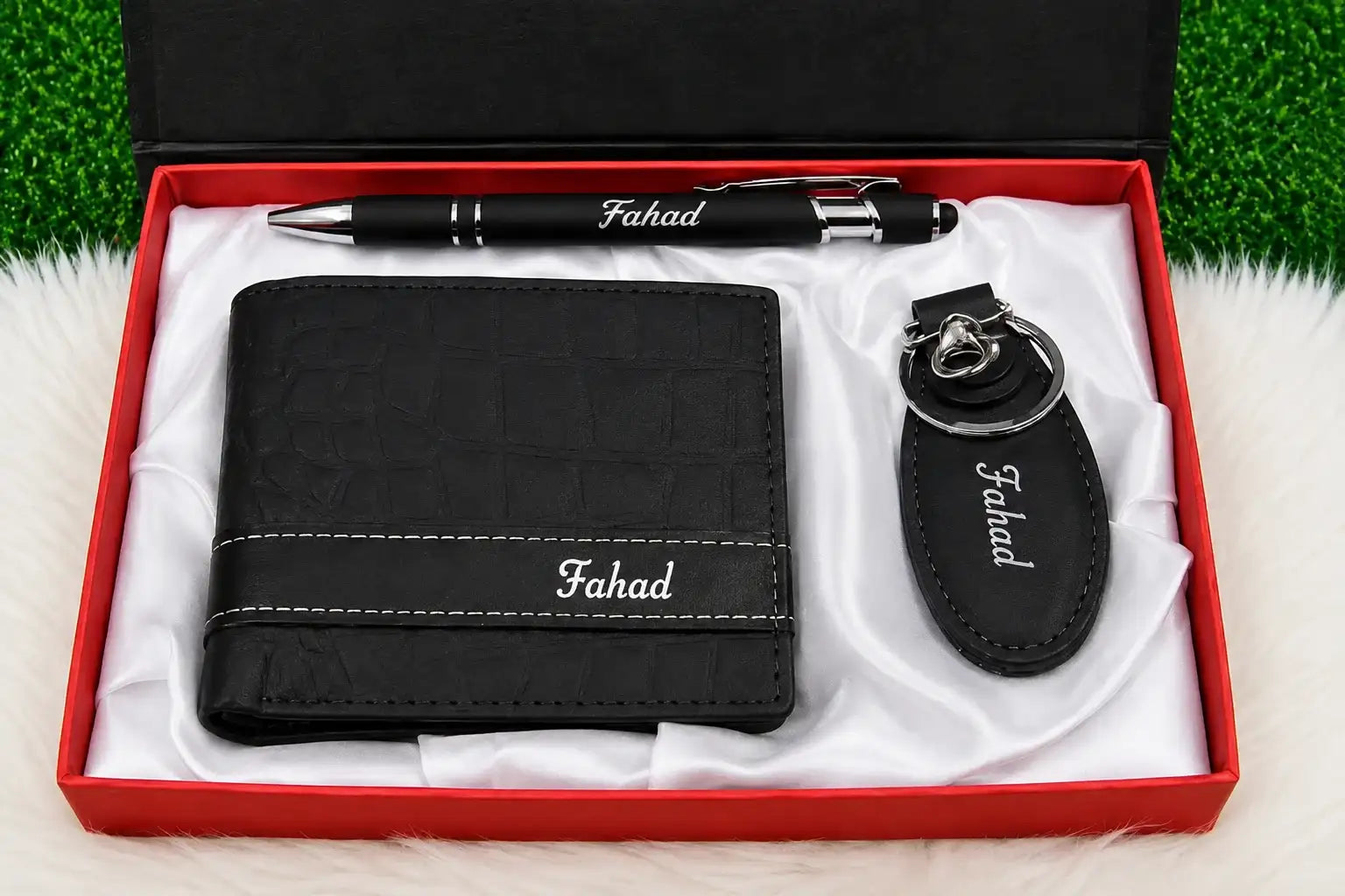 Black leather personalized wallet gift set with matching keychain and pen featuring Fahad name engraving