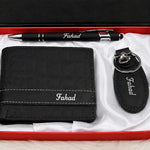 Black leather personalized wallet gift set with matching keychain and pen featuring Fahad name engraving