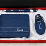Blue leather wallet with matching personalized pen and keychain arranged in a red gift box