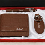 Brown leather wallet gift set featuring a personalized pen and matching keychain in a red presentation box
