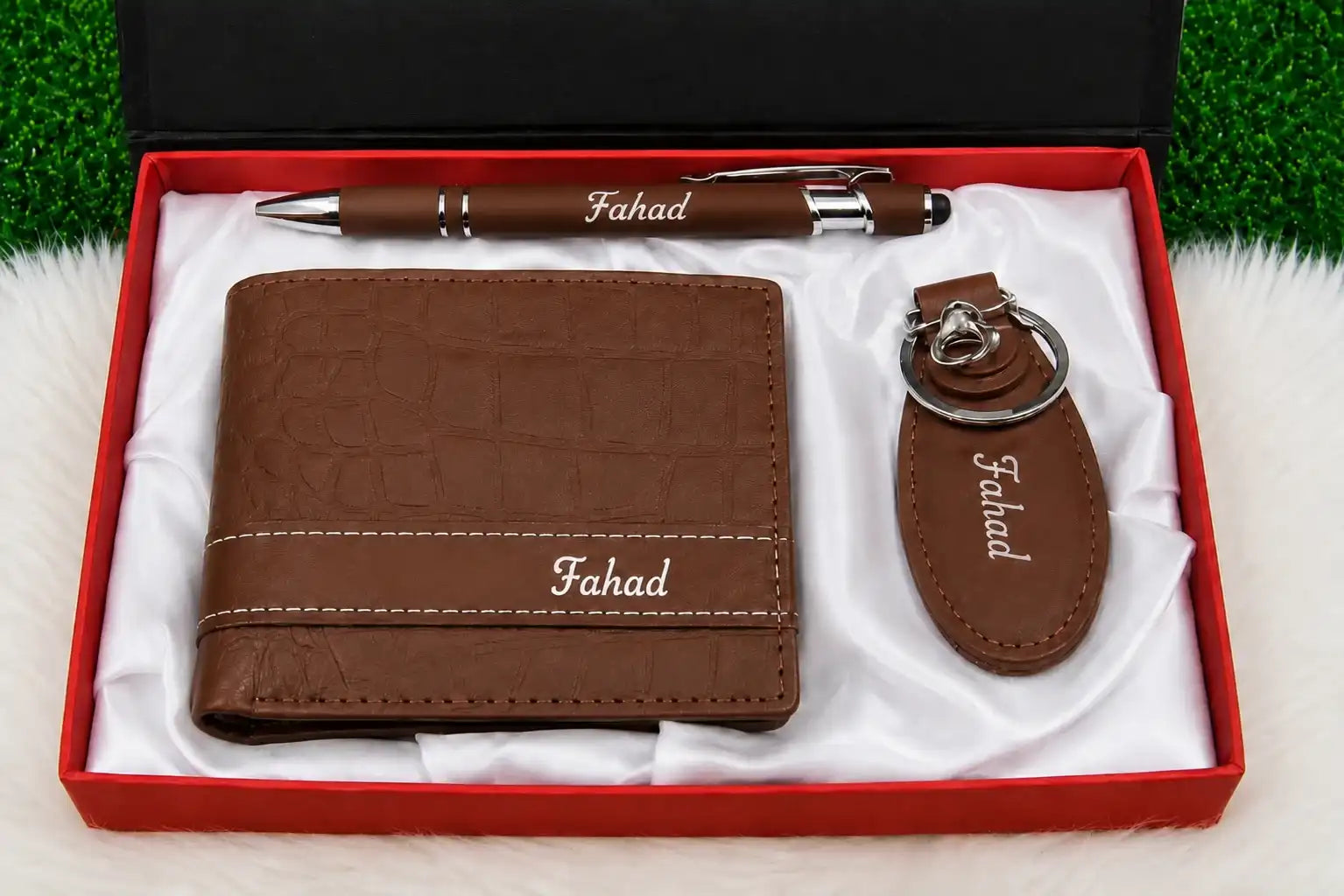 Brown leather wallet gift set featuring a personalized pen and matching keychain in a red presentation box