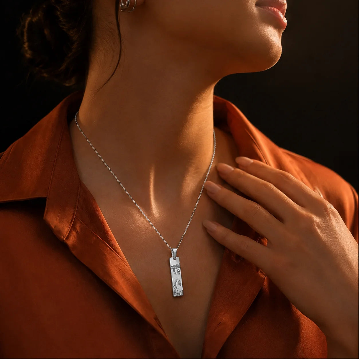 Personalized Eye Pendant necklace in silver worn on a fine chain, featuring a custom engraved rectangular pendant with a minimalist everyday jewelry design.