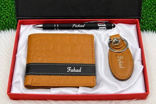 Personalized leather wallet gift set with custom name, matching keychain and pen in a textured tan wallet design.