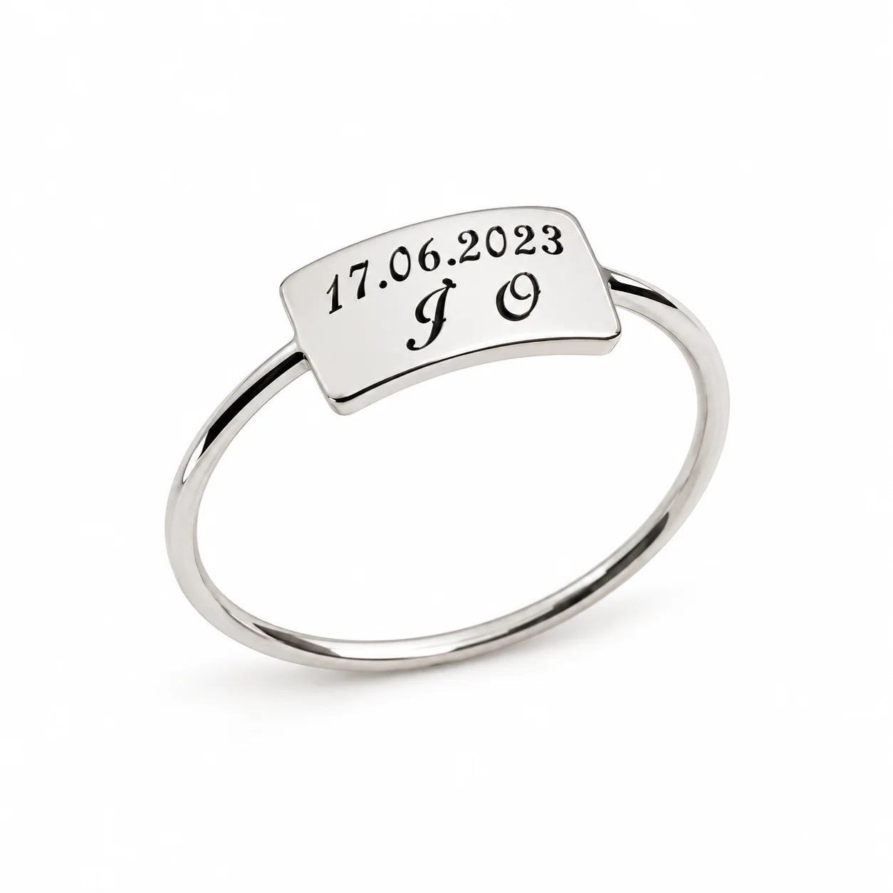 A silver ring with a rectangular top plate engraved with the date '17.06.
