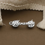 Personalized silver name pin featuring a custom script name in a sleek minimalist design.