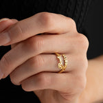 Woman wearing adjustable gold band ring with custom script names on open ends