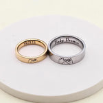 Pink Promise couple rings with interlocking pinky promise hand engraving and date detail