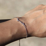 Sterling silver chain bracelet featuring Arabic word Hubb embellished with sparkling cz crystals worn on wrist
