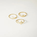 Three gold name rings spelling out 'Luna', 'Nathan', and 'Sofia' arranged on a clean white background.